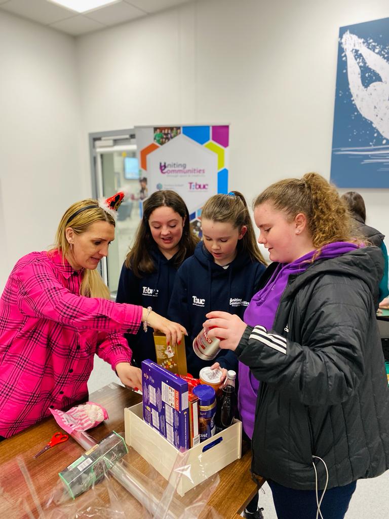 ss_ycc's tweet photo. Fantastic night at @CommunitiesNI #UnitingCommunities putting together 33 Christmas Treat Hampers for families in our community. We will be passing them unto the Foodbank now. Thanks DfC staff that came down to do the hampers with young people #tbuc https://t.co/9iKlf9Lf3x