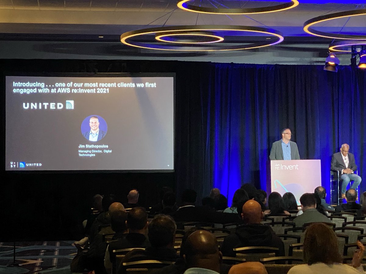USTglobal's tweet photo. Jim Stathopoulos of United Airlines discussing how UST is helping utilize the #metaverse to launch Airshop United Innovation Hub.

#BoundlessImpact #UnitedAirlines #reInvent #AWS https://t.co/ly5fs6ALSy