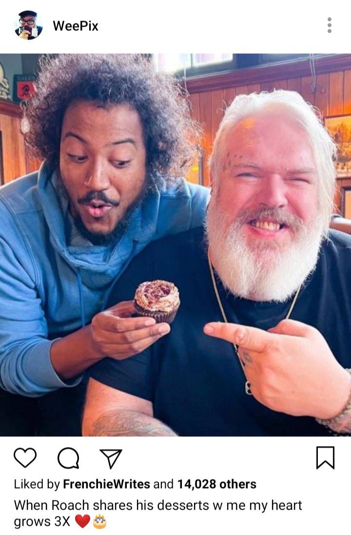 John's IG: picture of John and Roach with a cupcake. Caption reads "When Roach shares his desserts w me my heart grows 3x"