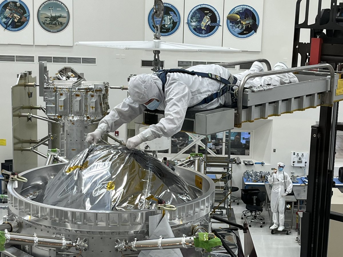 RPappalardo's tweet photo. The @EuropaClipper spacecraft’s main body went on quite a ride today: first across the clean room, then onto its shiny new “turnover fixture,” and now suspended sideways! It’ll stay there the next couple of weeks (unfortunately, out of the livestream view). #GoClipper #PI_Daily https://t.co/9rPNOW8U7p