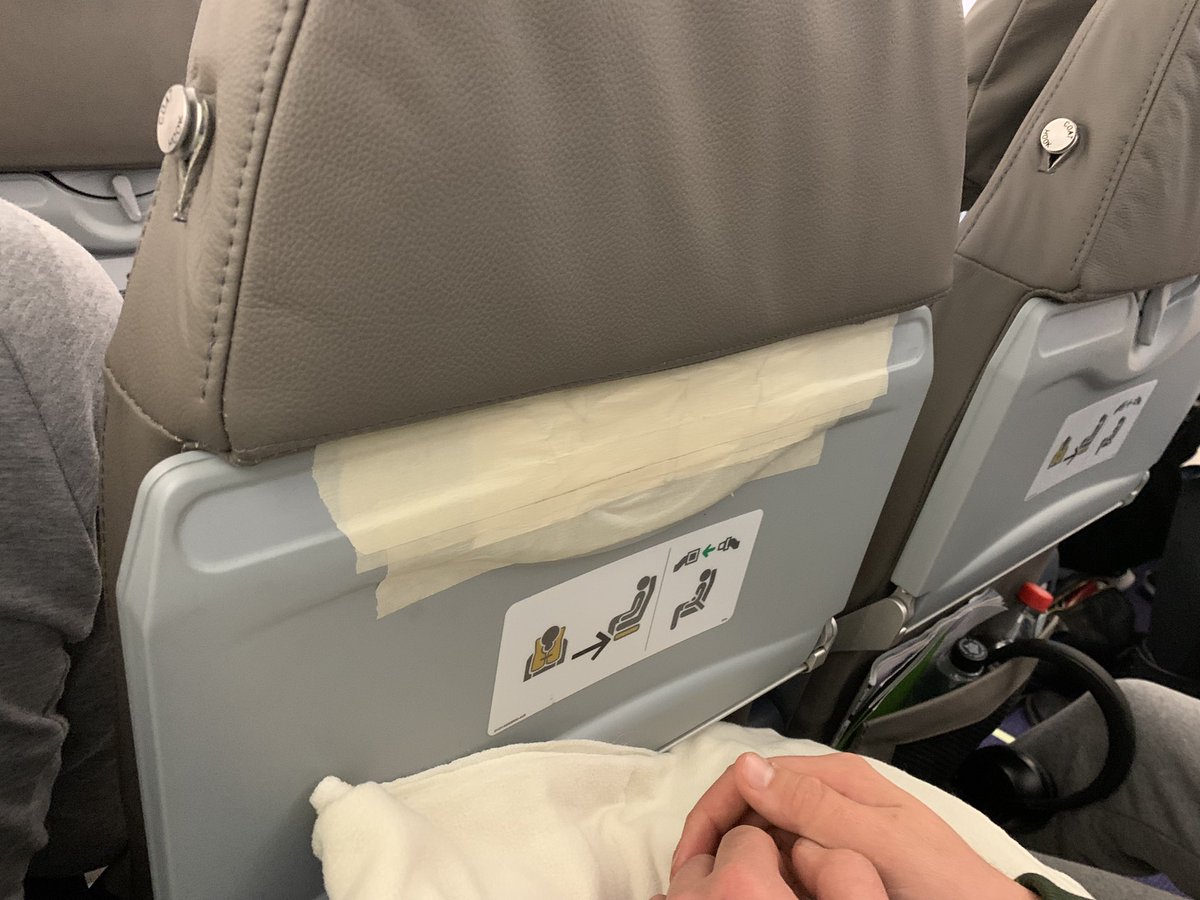 Lex081's tweet photo. @TUIUK please tell me why it was acceptable to take the Dreamliner we paid a premium for out of service for “unscheduled maintenance” but replace it with a plane that uses masking tape to keep the seat trays together? https://t.co/jqv04GmDGU