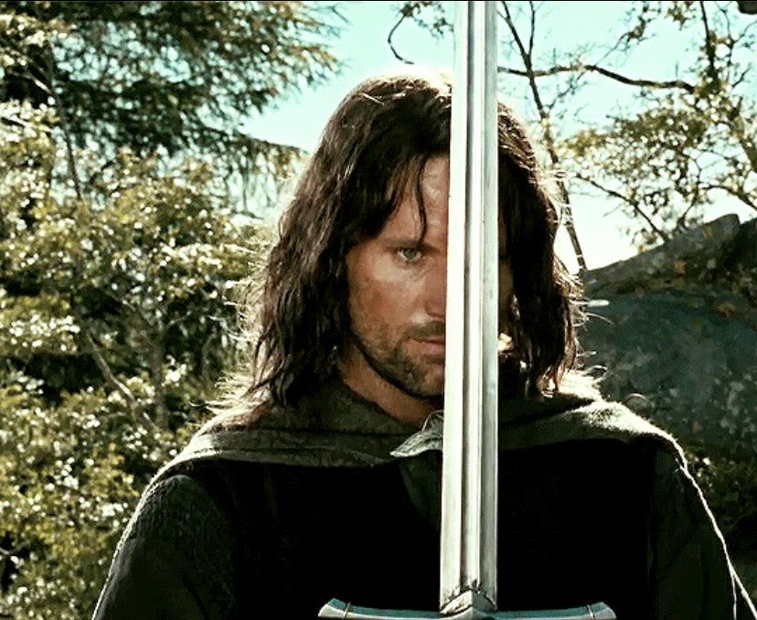 libby on X: “aragorn holding his sword infront of his face will