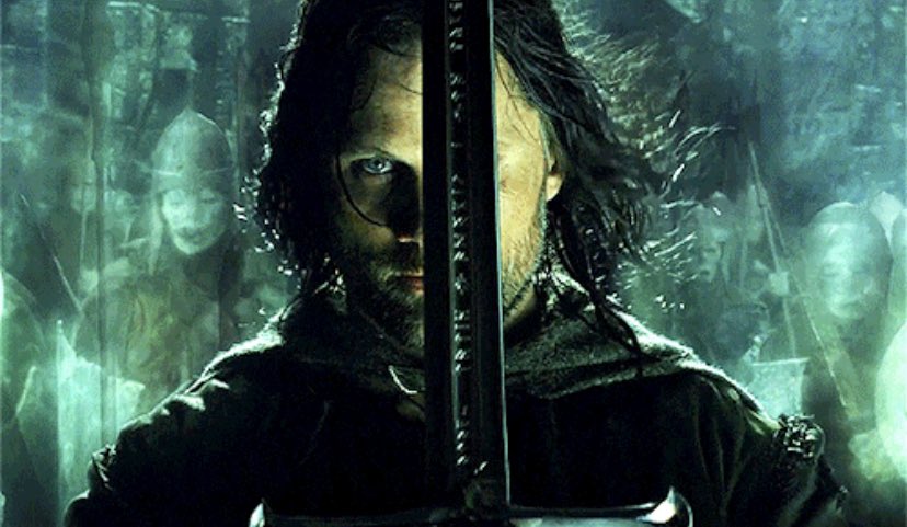 libby on X: “aragorn holding his sword infront of his face will