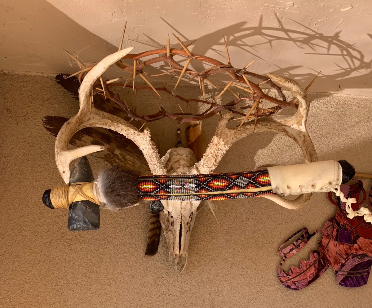 Just finished another tomahawk with obsidian Apache tears on both ends  , beads from a loom around the handle , rawhide grasp and flint from England… and rabbit fur . #flintknapping