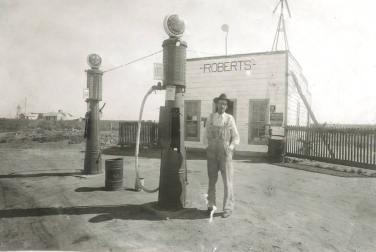 TracesofTexas's tweet photo. Tory Roberts sent in this shot of his Great Grandfather, John Alton Roberts, at his filling station in Meadow, TX. Per attached note: "No water, no electricity. Windcharger for radio and lights. Gas was 15 cents for regular, 18 cents for Ethyl. Lived in back part of the station." https://t.co/iWwLF7gfp1