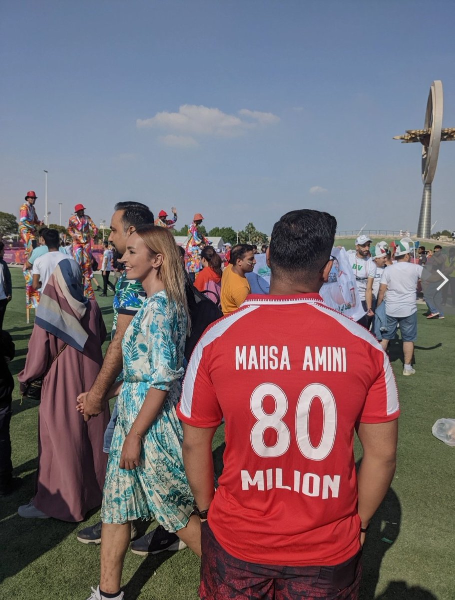 Victor_P_Arthur's tweet photo. One fan has shown his support to Mahsa Amini outside the Khalifa Stadium where England play Iran this afternoon.

She was the 22-year-old Iranian woman whose death in September, after being detained by police for allegedly breaking strict hijab rules, sparked mass protests. https://t.co/tOBUiIufnP