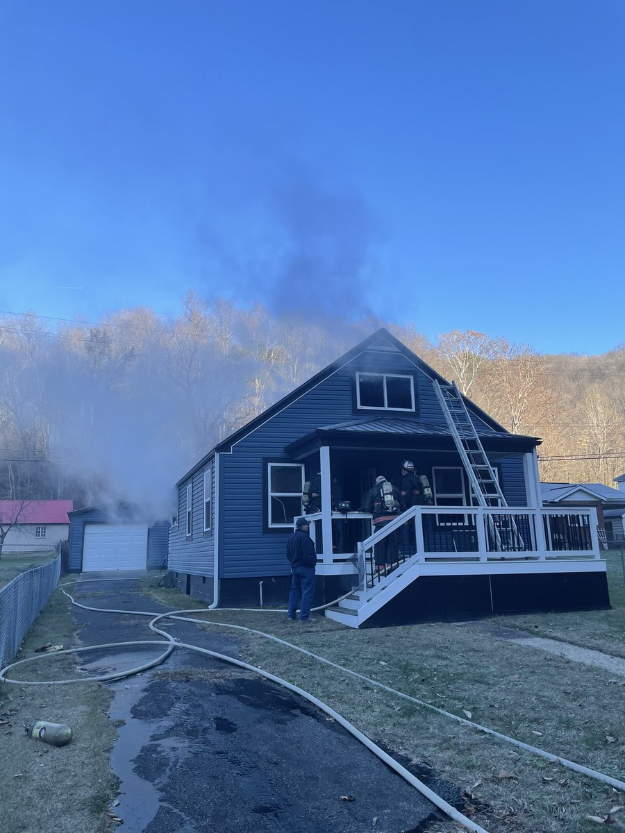 McD7575's tweet photo. City of Logan FD on scene 11/21 at Crooked Creek Rd for a story and a half single family dwelling. Heavy fire showing on arrival. Interior attack was made and fire knocked within 10 minutes of arriving on scene. Overhaul in process at the moment. #LFD #TenHouse https://t.co/PhsPWB44Ga