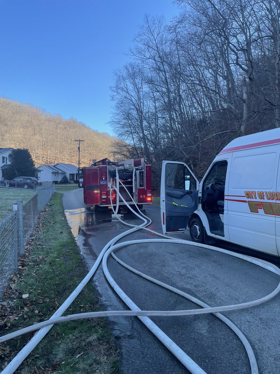 McD7575's tweet photo. City of Logan FD on scene 11/21 at Crooked Creek Rd for a story and a half single family dwelling. Heavy fire showing on arrival. Interior attack was made and fire knocked within 10 minutes of arriving on scene. Overhaul in process at the moment. #LFD #TenHouse https://t.co/PhsPWB44Ga