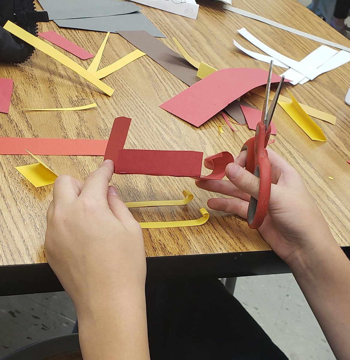 Student asks, "Can you guess what I'm making?" I love when the Paper Sculpture Center opens. #paperart #teachingforartisticbehavior #LSR7elementaryART