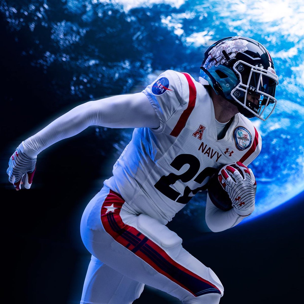 UAFootball's tweet photo. From the sea 🌊 to the stars 💫. The Midshipmen of @NavyFB are rocking a NASA inspired uniform during this year's Army vs Navy game. We created a Navy x NASA line that’s out of this world.

https://t.co/LLbf7TJV4E https://t.co/wsvryr90cT