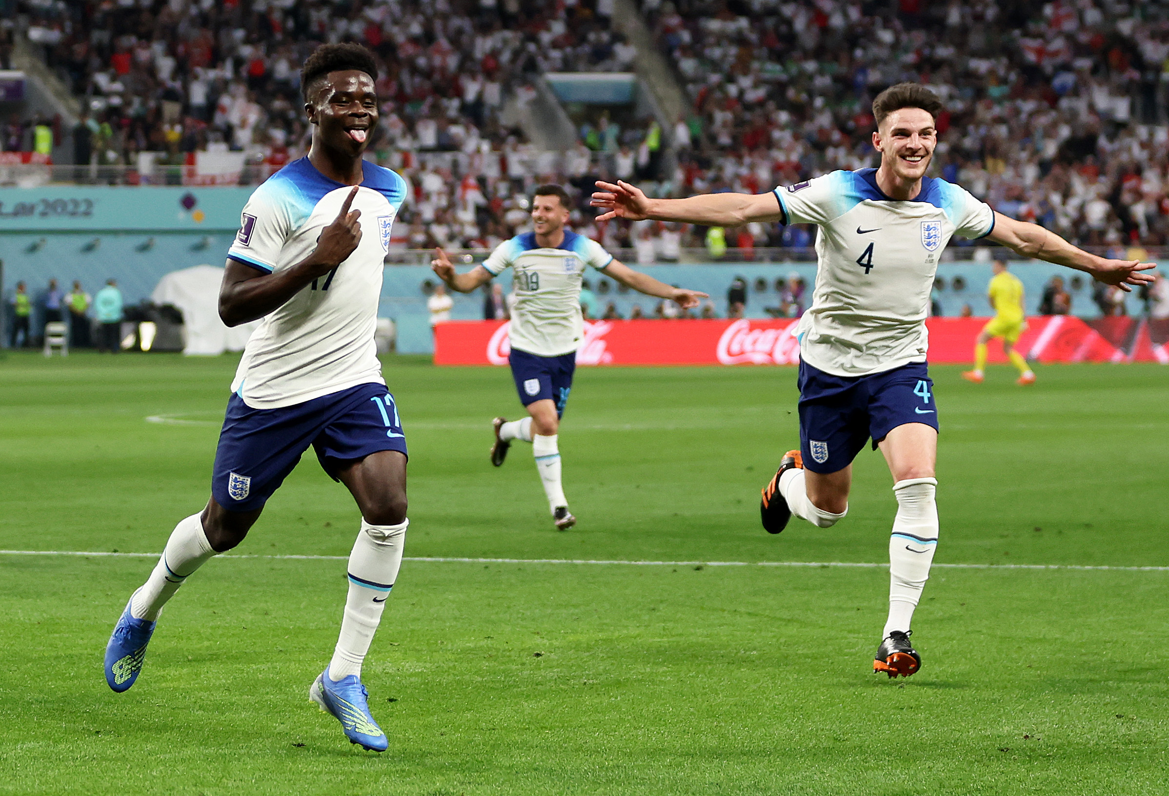 Bukayo Saka and Declan Rice celebrate.