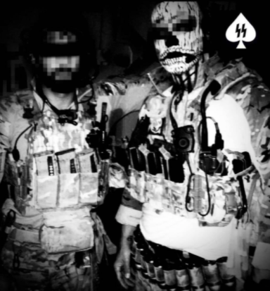 Two members of Ace wearing tactical gear with censored faces