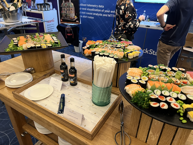 gostackstate's tweet photo. How about time traveling back to last night for more sushi &amp; champagne?! With #StackState, you can time travel w/in your stack &amp; see what change caused an incident. Stop by booth 306 &amp; see #observability, the StackState way. Enter to win a Sanctus Sanctorum Lego set. #GartnerIO https://t.co/GhaASM1j7k