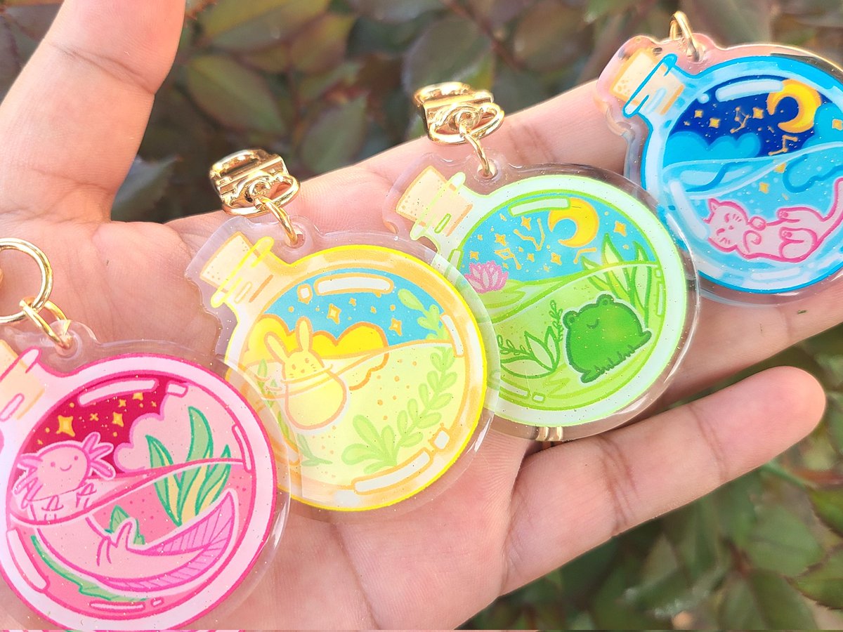 My pet potions in acrylic charm form courtesy of <a href="/VograceCharms/">Vograce</a> !! ✨️🥺 Some of my favorite designs I've ever made!~ #kawaiiart #originaldesign #axolotl #bunny #frog #cat