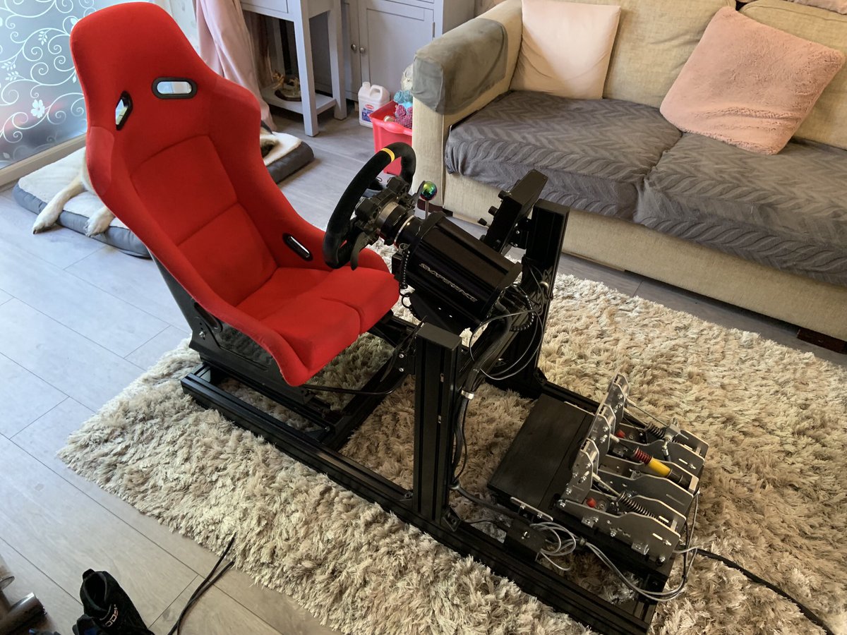Rig_Racer's tweet photo. We are now reaching the final stage in my #simrig setup and it’s what I now use for my #Simracing I swapped out my DIY wooden rig for a #simlabs GT1 EVO and a rather bright bucket seat ! With the sim cupboard now painted I think it’s time to stop tweaking, maybe 🤔 https://t.co/SylYIppyW4