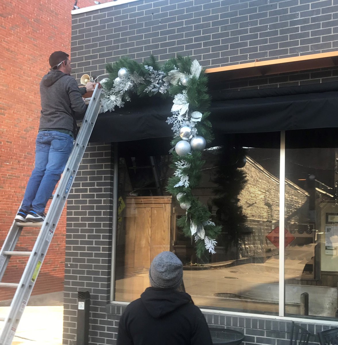 Madisonsjcmo's tweet photo. It's begun.....getting ready...! Awesomeness in progress!   @RiverCityFloris  is beginning the decorating of Madison's façade!  We can't wait to see the beautiful finish! They always do such a wonderful job!  What great neighbors!  Stay tuned! ❤
#JCMO #feelingfestiveatmadisons https://t.co/HkyvdJCtUT