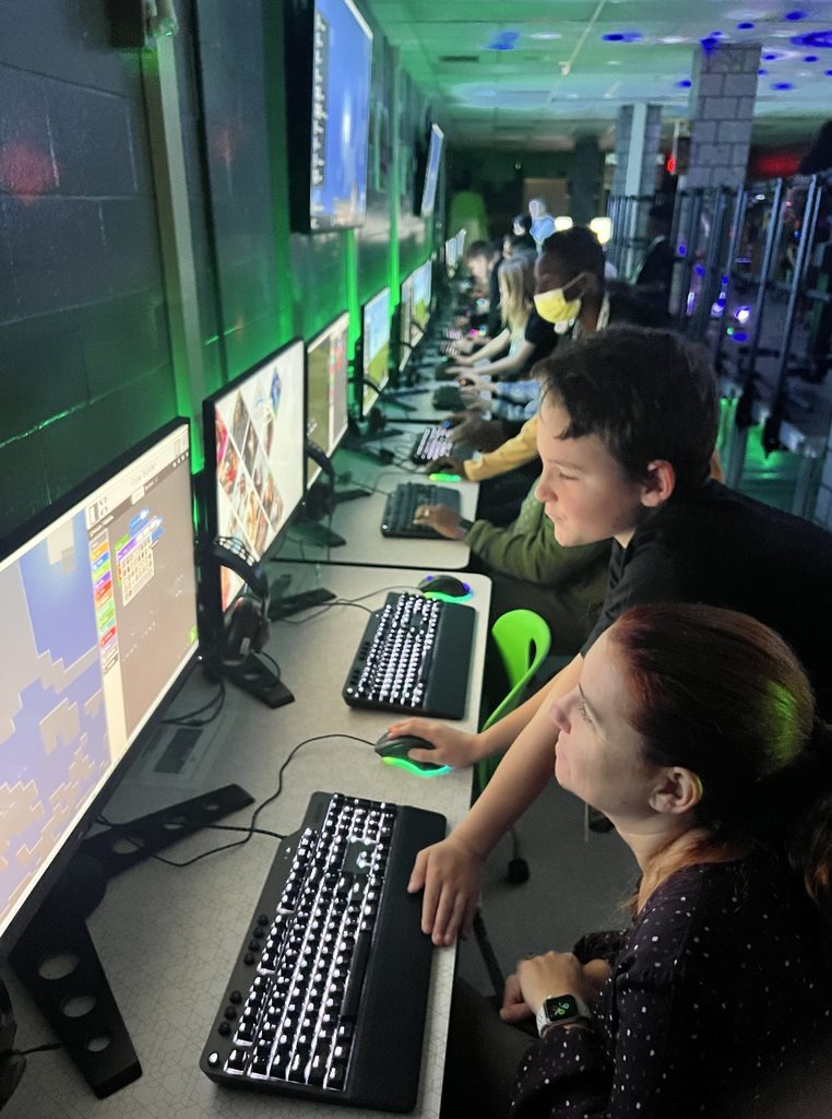 DCPSInTech's tweet photo. What a great night with the #MinecraftStudentAmbassadors teaching their parents how to use #Python. They were so confident and proud, and rightfully so! Thank you @NadineEbri for leading these great group of coders! https://t.co/E0HKBOGb9T
