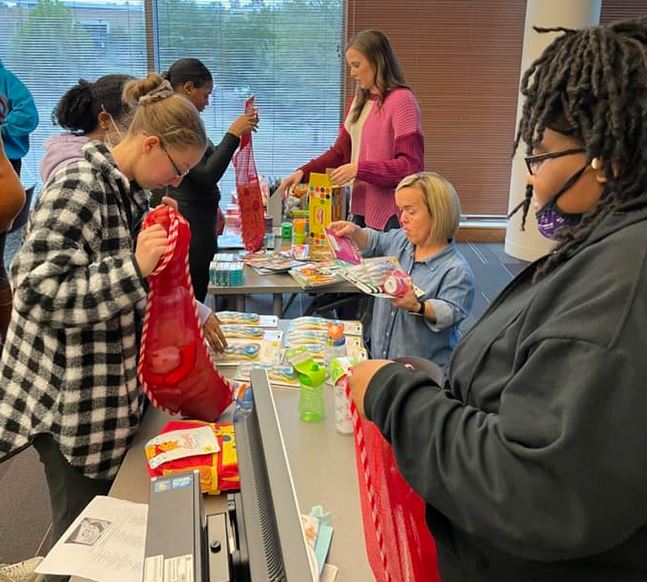 Shoutout to students in the #MGA Horizons club (for students in the Bachelor of Science in Social Work program) who gathered together to fill stockings for the Salvation Army Christmas stocking drive. #KnightsServe 💜