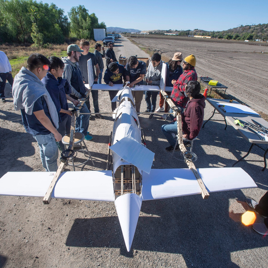 cppengineering's tweet image. Students set up an eVERT aircraft as it takes flight for a hover test at Spadra Farm.