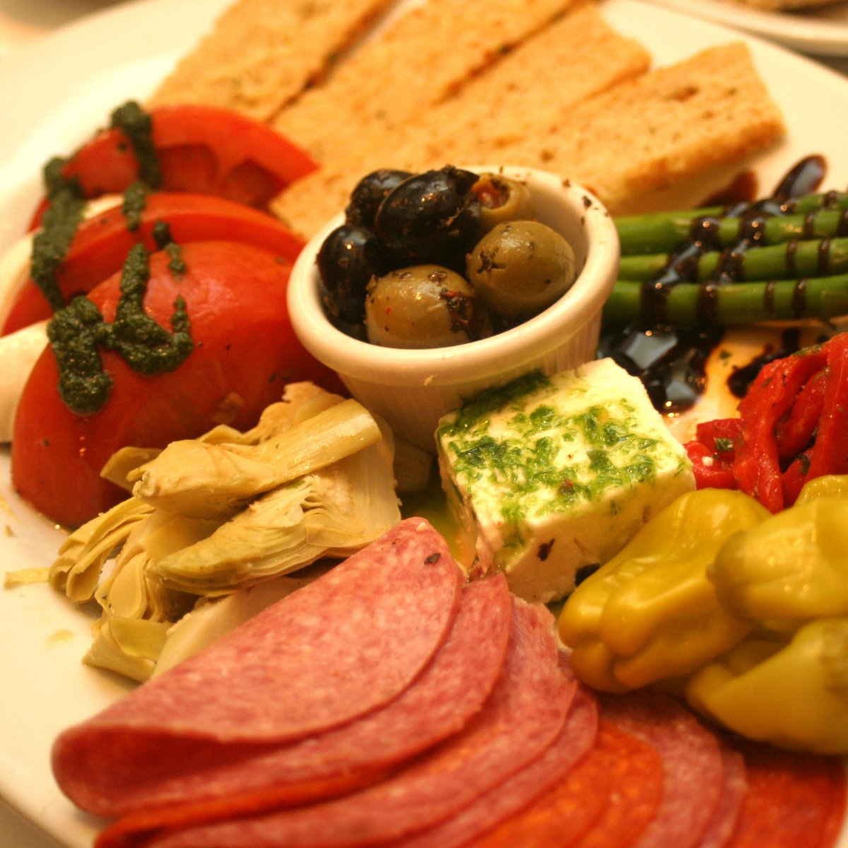 Before your kitchen goes into total chaos for Thanksgiving, take it easy on your whisks and baking dishes by chowing down on an antipasti platter from our place.