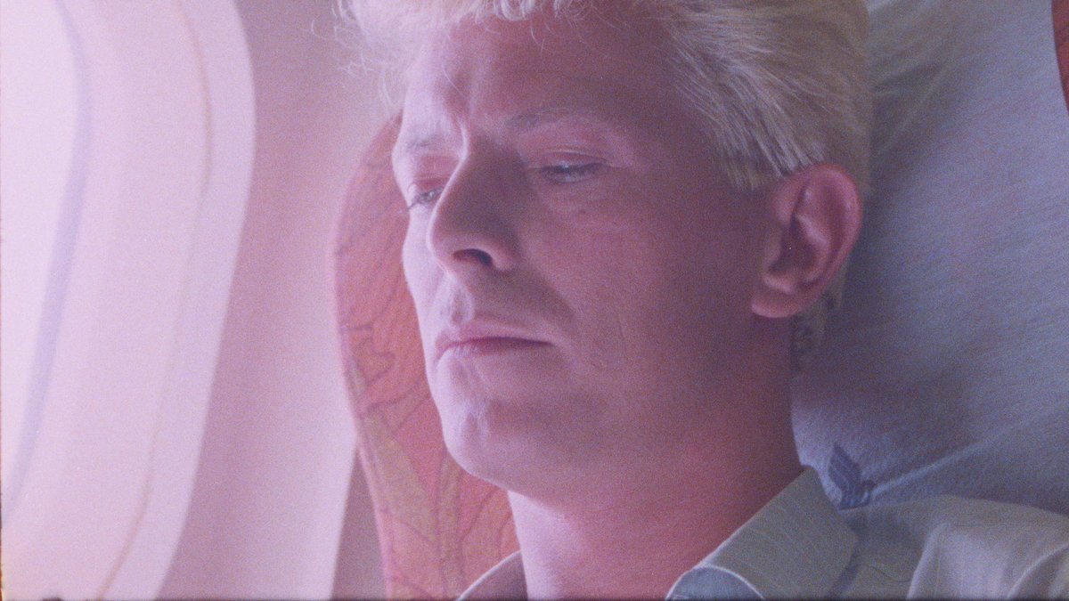 For me, color correcting archival films is never about restoration, but intent.  For this shot, I wanted to warm it up and enhance the contrast to look like he was entering a new chapter.  The orange/blue hues are part of the #MoonageDaydream palette.