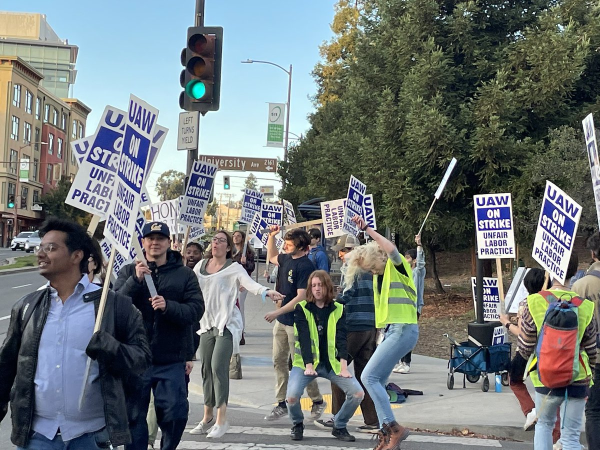 BenGoldmanH's tweet photo. From yesterday’s West Crescent picket line. Impromptu dance party. #ucstrike #UAW5810 #UAW2865 #UAW #UCBerkeley https://t.co/SgTMtnHVbb