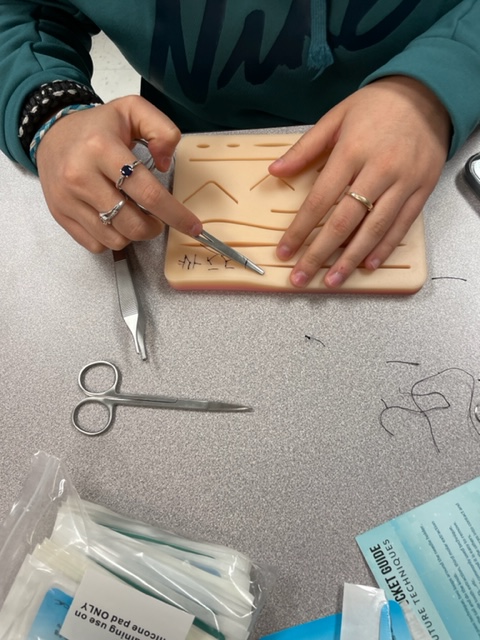 Way-Med students learning about medical professionals and perfecting the art of suturing injuries as part of their wound care lesson. They learned continuous, simple-interrupted, and mattress stitches. They also got a demonstration on a tendon repair. #ItsABeautifulDayToSaveLives