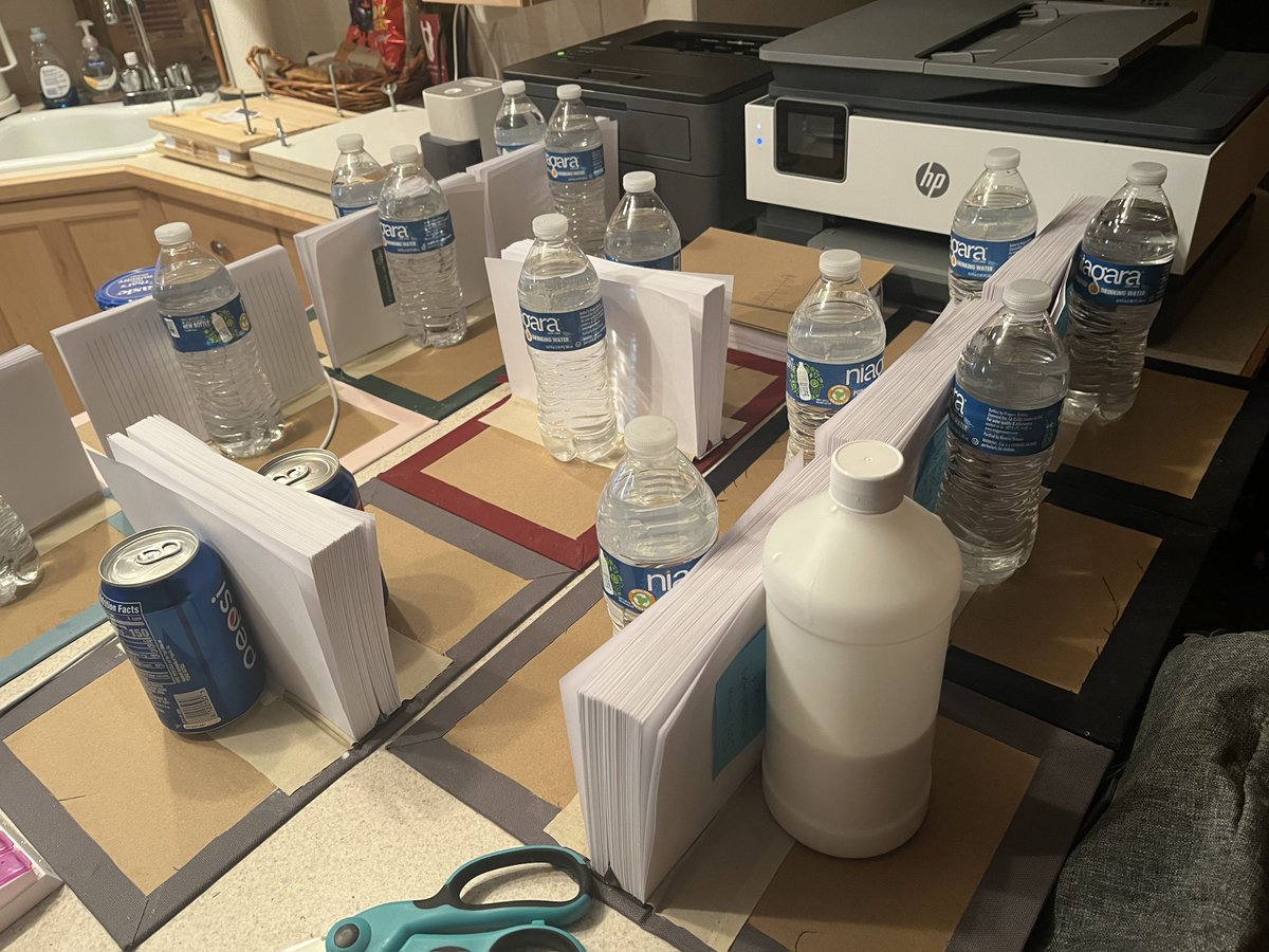 BirdCommissions's tweet photo. Sometimes you have to get creative 😂😂
I needed a way to keep the pages upright while the spine dries after attached to the cover, so water bottles seemed the best way to go! Sometimes I use other books to do this, but I'm in the process of moving and all my books are in boxes. https://t.co/cCjopdgt5c