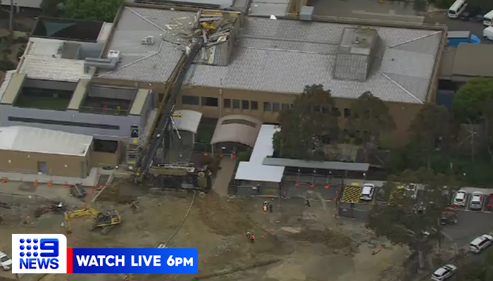 9NewsMelb's tweet photo. DEVELOPING: A piling rig has toppled over at Frankston Hospital, smashing into the roof of the building.

The hospital's psych ward is being evacuated following the incident, with no injuries reported at this stage. #9News https://t.co/wIZbyPFJY7