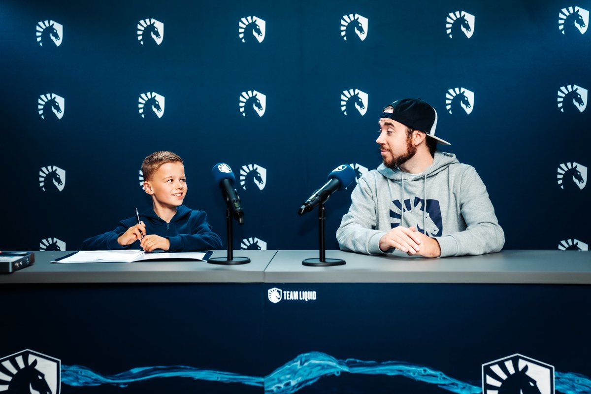 [photo of EliGE & Liquid signing, c.2015 - colorized]