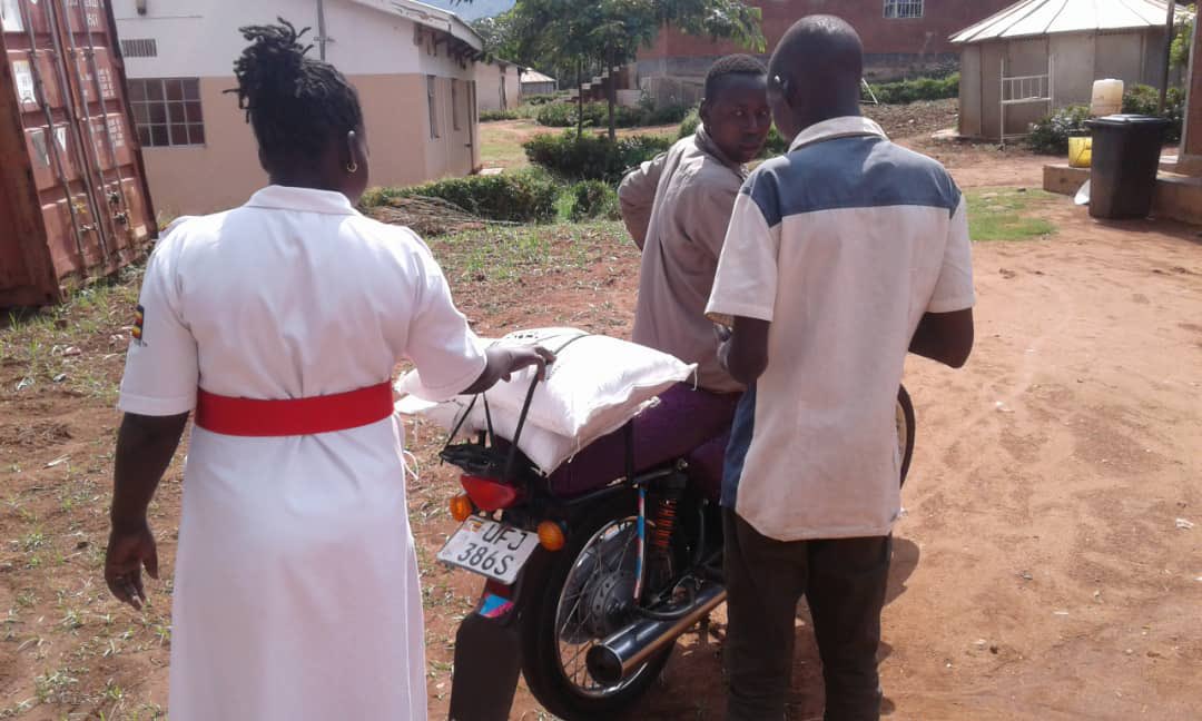 PomuUganda's tweet photo. Our Partners @NAFOPHANU and their District Coordinators are giving out food in areas of Karamoja Region to communities of People Living With HIV 
@IrlEmbUganda
@UNAIDS_UG
@aidscommission
@AKF_EA 
#BeyondMyPill
#TogetherforaPositiveDifference https://t.co/5W6RAVNAsV