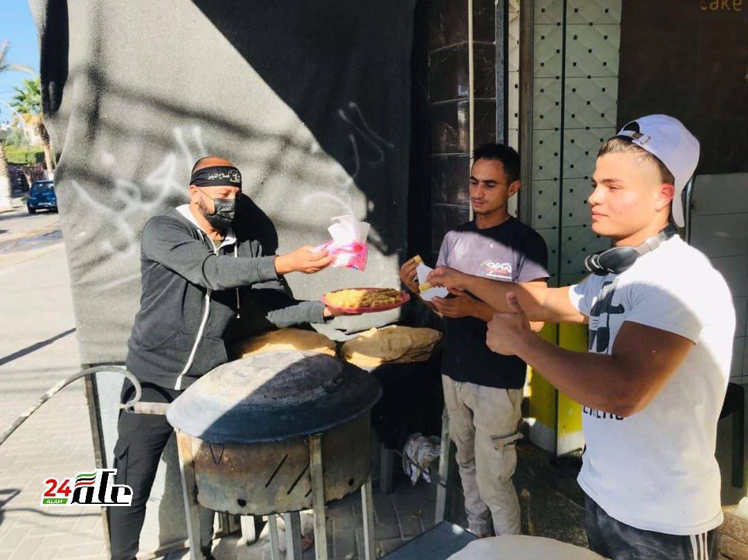 AviMayer's tweet photo. Palestinians in Gaza distribute sweets in celebration of this morning’s double terrorist bombings in Jerusalem, in which a 15-year-old student was killed and 18 others wounded. https://t.co/PnulztipGx