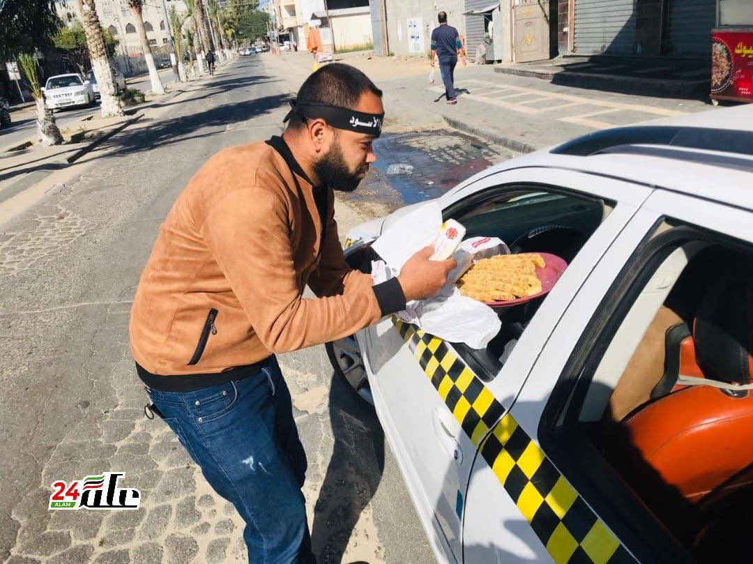 AviMayer's tweet photo. Palestinians in Gaza distribute sweets in celebration of this morning’s double terrorist bombings in Jerusalem, in which a 15-year-old student was killed and 18 others wounded. https://t.co/PnulztipGx