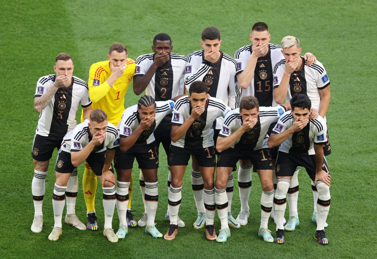 jonathancrane5's tweet photo. The TV cameras missed it, but here are the Germany players covering their mouths before the game with Japan. #FIFAWorldCup https://t.co/M8LRVaOeQV