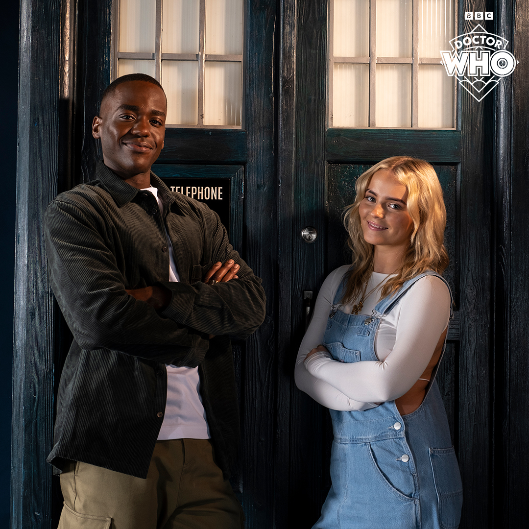Ncuti Gatwa and Millie Gibson pose together outside the TARDIS for the announcement of Gibson as the new companion, Ruby Sunday.