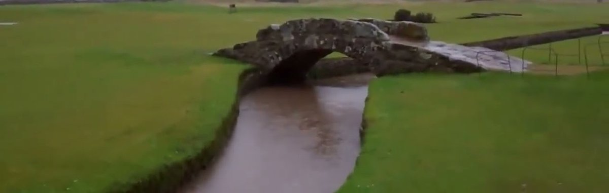 tourscotland's tweet photo. Tour #Scotland travel Blog video of rain and flooding by the #Swilcan #Bridge on the 18th Fairway of the Old Royal And Ancient Golf Course on ancestry genealogy family history visit and trip to #St #Andrews #Fife A cultural icon in the sport of golf https://t.co/5AddPc4Yyy https://t.co/Itg2IpBRQ8