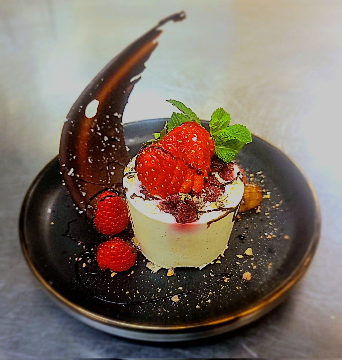 One of my special desserts of the eveing ..... white chocolate and raspberry panna cotta,  caramised orange , bisciut crumb and a dark chocolate and coconut salt tear drop