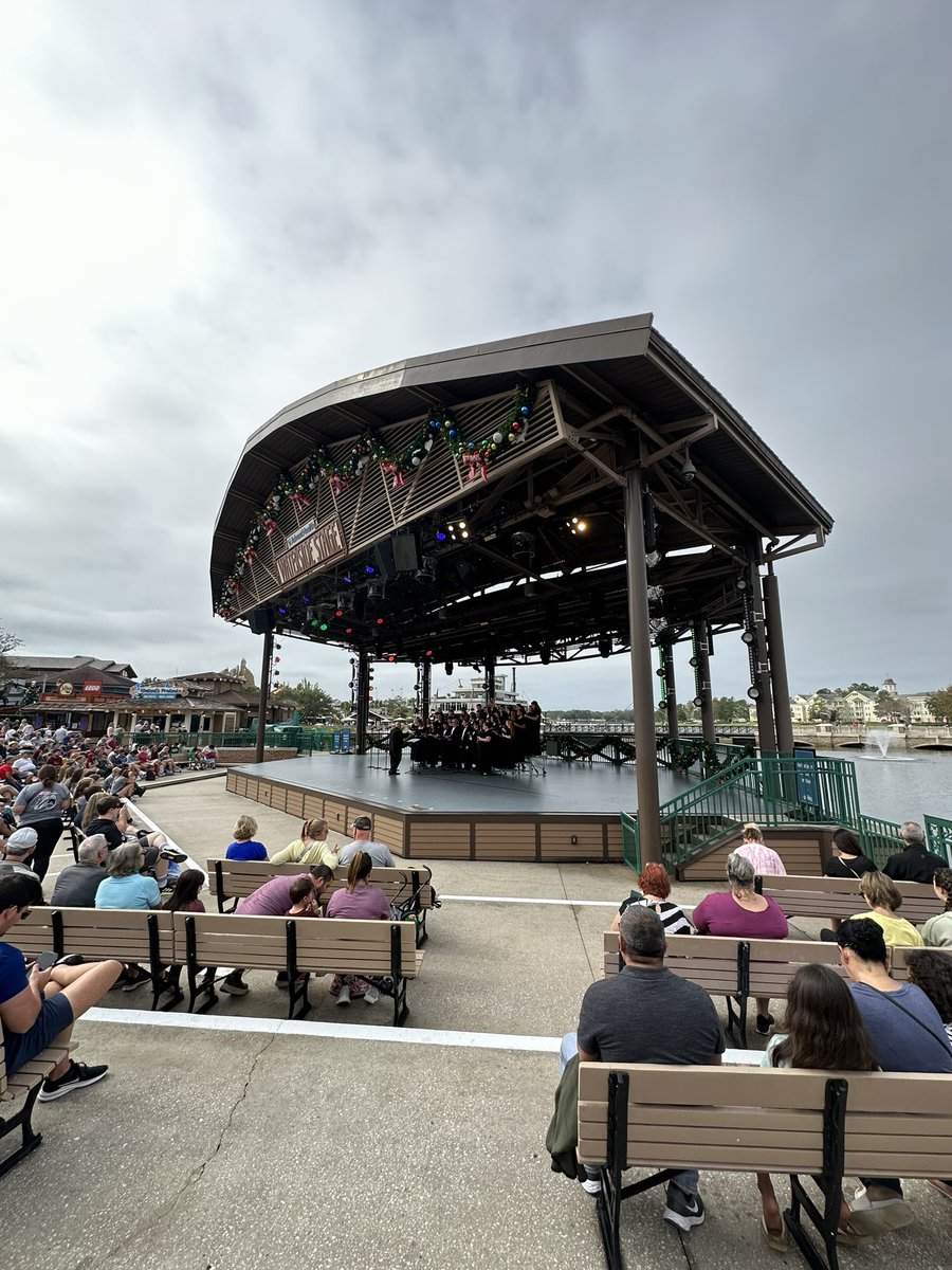 FeinestBand's tweet photo. Chorus is killing it! Singing right on the water at Disney Springs. Great job, choristers! Great job, Kevin Doherty! Go Wolverines!!! #wcsdletsgo https://t.co/qxCYqznOOW