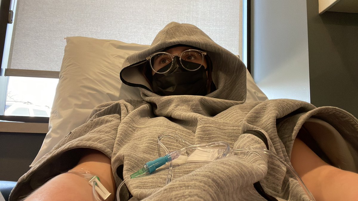 EmyleWatkins's tweet photo. Being a hermit in this sweater (thanks @Nike for this accidentally adaptive fit) during my infusion. Second dose of #SimponiAria. 15 minutes in and already feel like garbage 🤪 #DisabilityTwitter https://t.co/YDVgchGLzh