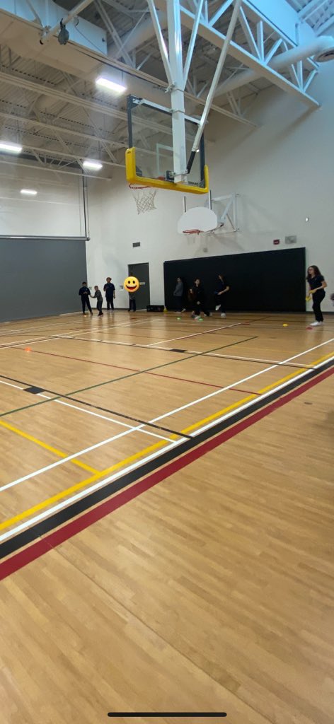 Miss_FergusonH's tweet photo. In gym, we used our target and cooperative skills in a game of BeanBag Bocce, where students worked in teams to get their team’s coloured beanbag closest to the middle pylon. @StGregoryHCDSB https://t.co/flNUIw1I9W