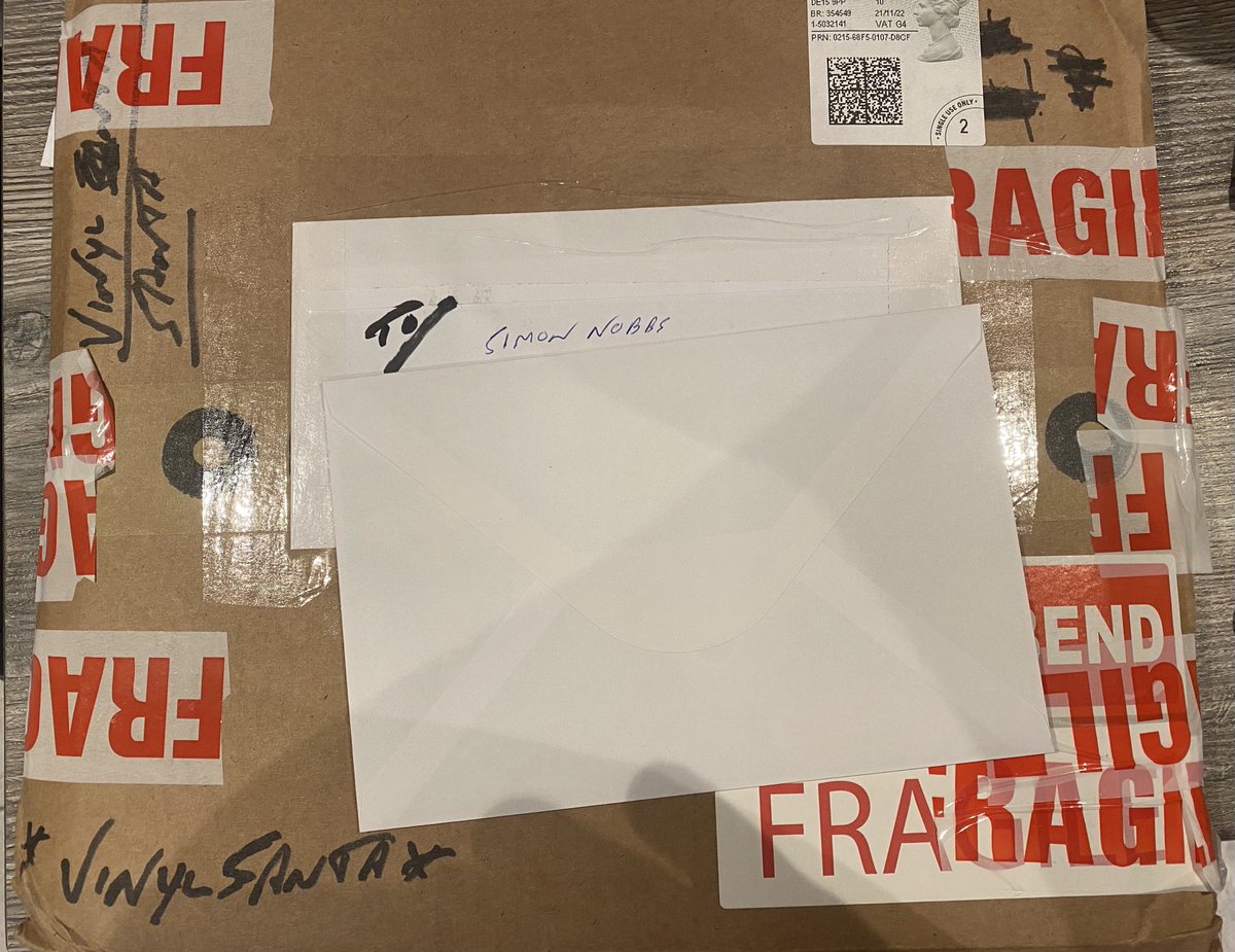 SimonNobbs's tweet photo. Incredible scenes as I come home to find my #vinylsanta has been delivered over a month early! Very very efficient and has me feeling rather festive. ⁦@Vinyl_Santa⁩ https://t.co/LuQa51ThEw