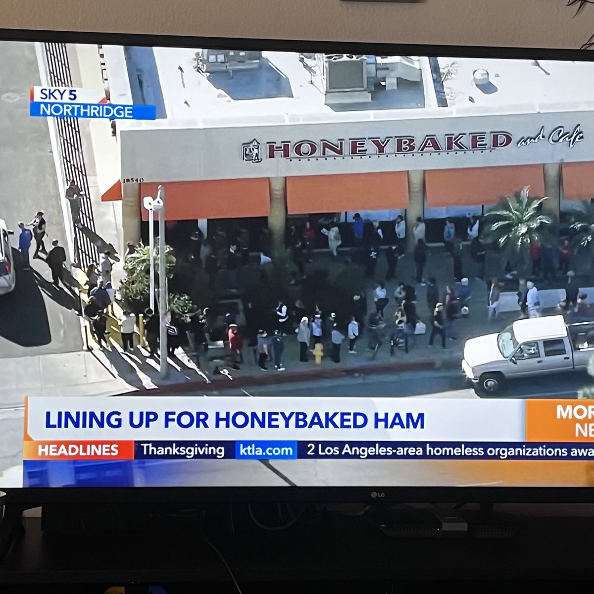 audipenny's tweet photo. the news today is everyone needs ham. everybody’s trying to get into the ham store and a helicopter is watching them https://t.co/5nZLdZ0lWx