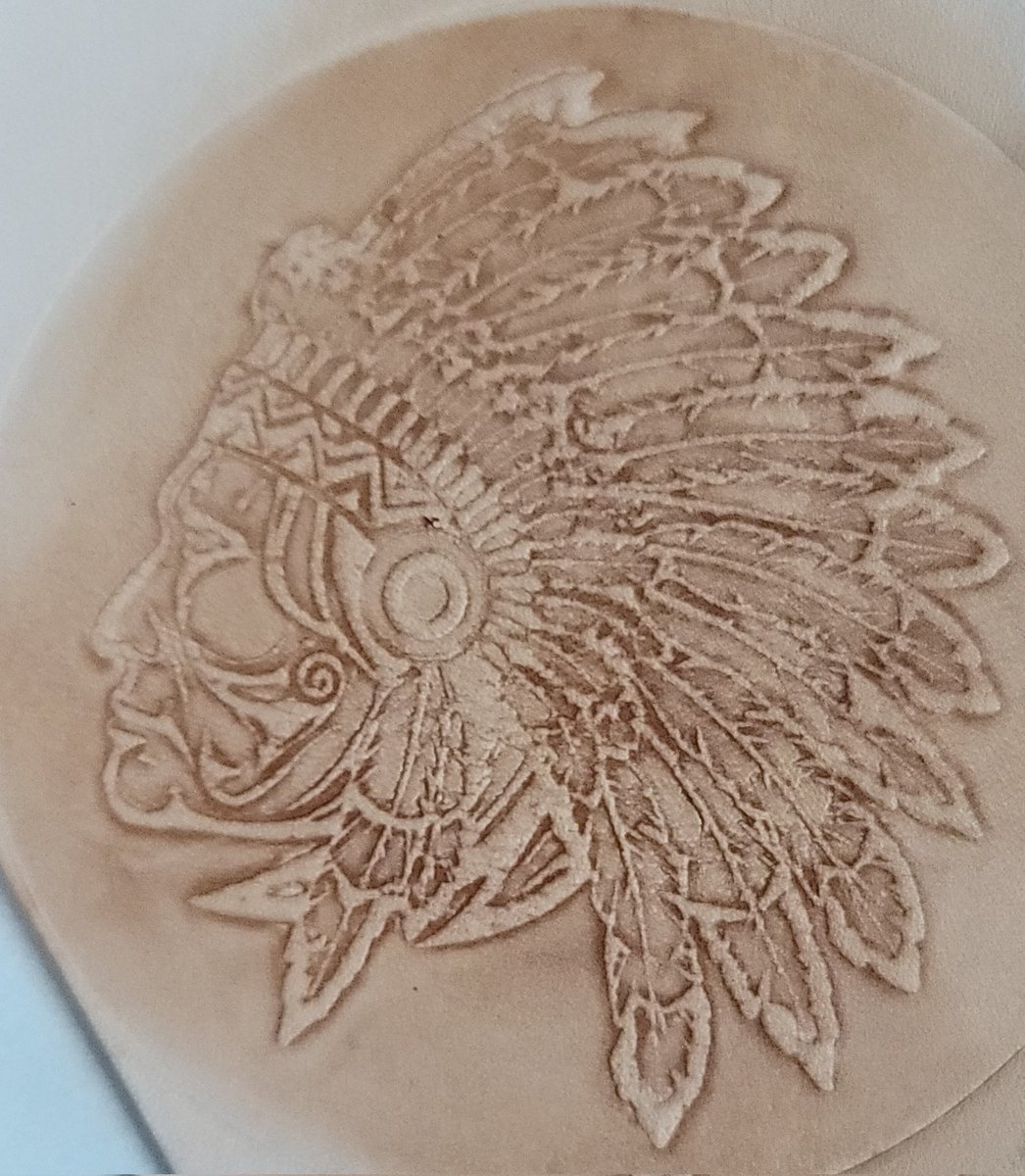 Boomhauer17's tweet photo. Used my laser engraver to make myself a new embossing stamp out of a piece of acrylic, the head is 3" X 2.5", I tried it out on a scrap piece of leather that I had laying around. 

#NativeAmerican 
#NativeProud https://t.co/vGZrFOLWyP