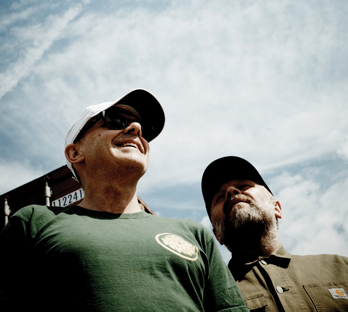 Both members of Leftfield looking at the sky