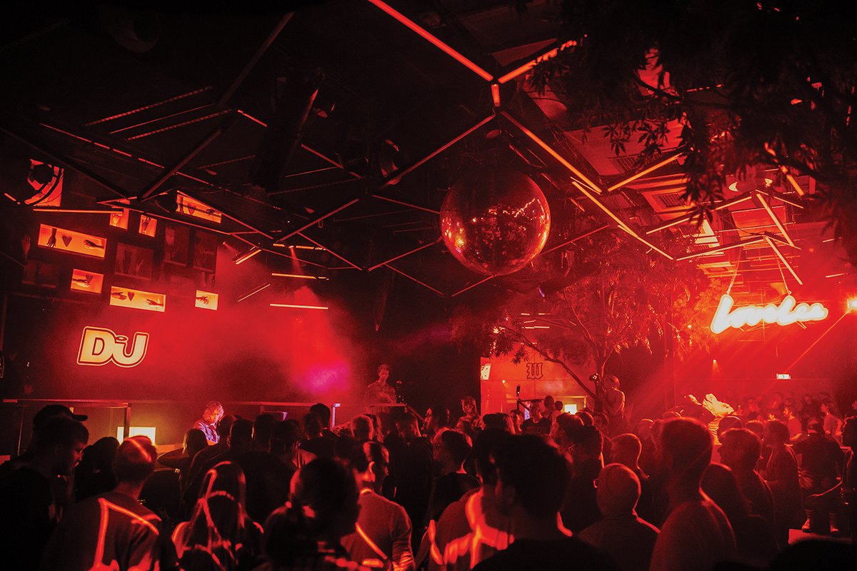 Photograph of the red DJ Mag light hanging over the dancefloor of Amsterdam's Lovelee club