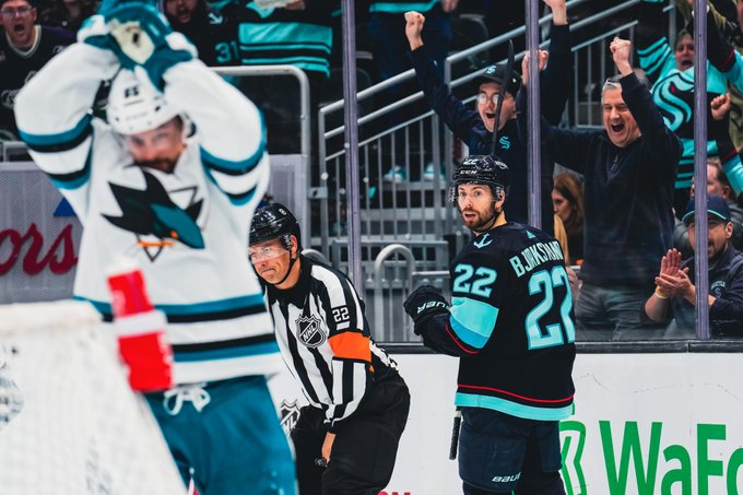 bjorky looking back at sharks player who's about to break their hockey stick after bjorky scored