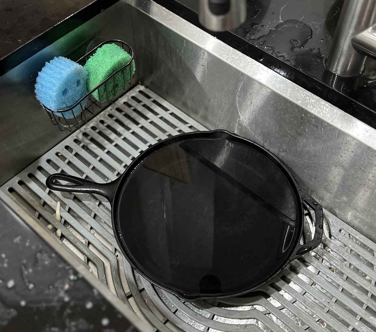How long should I soak cast iron before putting it in the dishwasher?