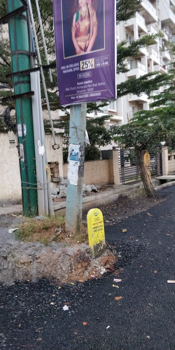 hkallae's tweet photo. @MTF_Mobility there are these man holes left above the road level, which can cause accidents. Can you get this fixed? also can the transformer be moved and the road can be extended? This is near SSVR Tridax apartment balagere road. https://t.co/5Ki2Ob6Xmf