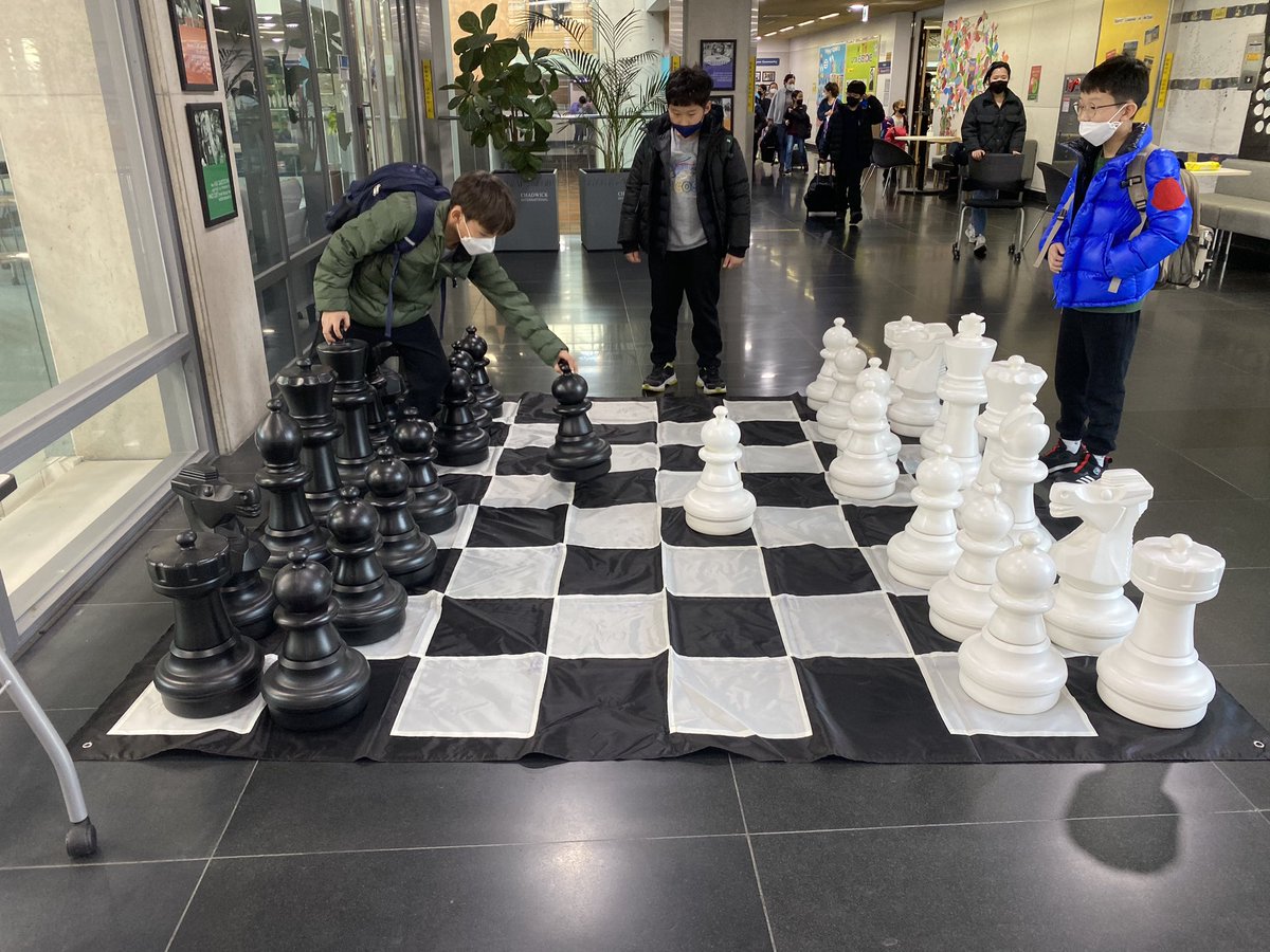 Ss @Intl_Chadwick playing with the giant chess board for the first time in a long time!! #play #chess #connection