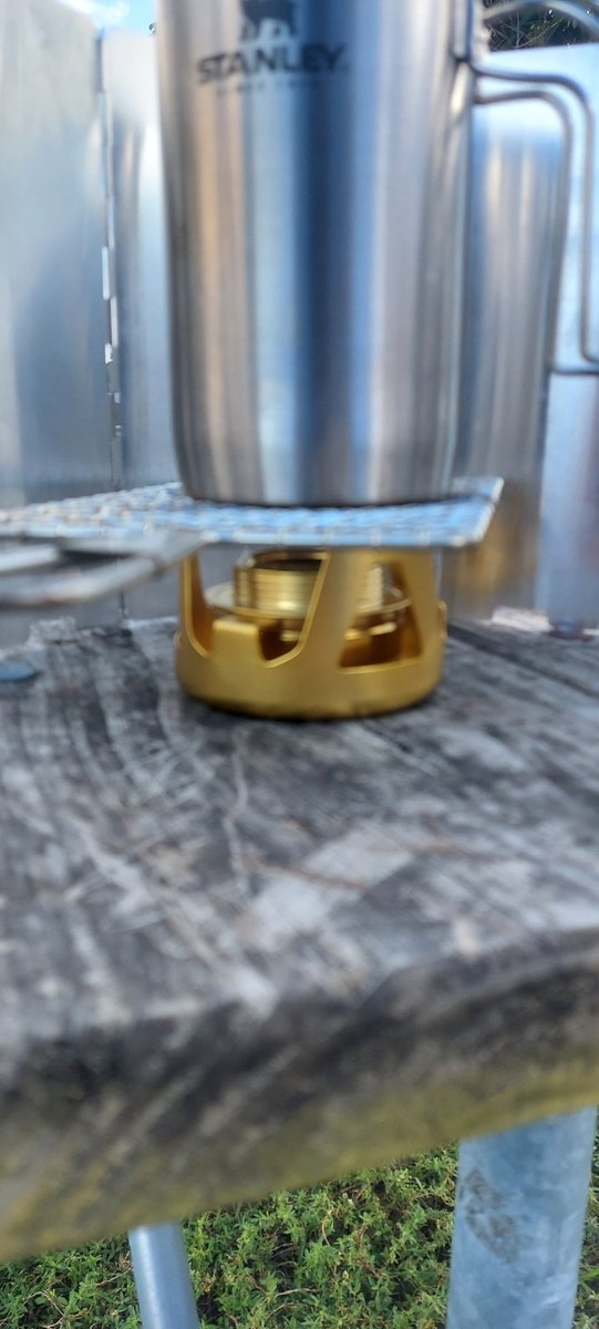 NoirPrepper's tweet photo. Trying out an alcohol stove I recently bought. Had to use a grate to accommodate the coffee press (will have to modify something for a tighter fit) but it did the job. 
Always practice your preps before you have to use them.
#Prepper 
#alcoholstoves
#practiceyourpreps 
#camplife https://t.co/OLXp7Zlsuj